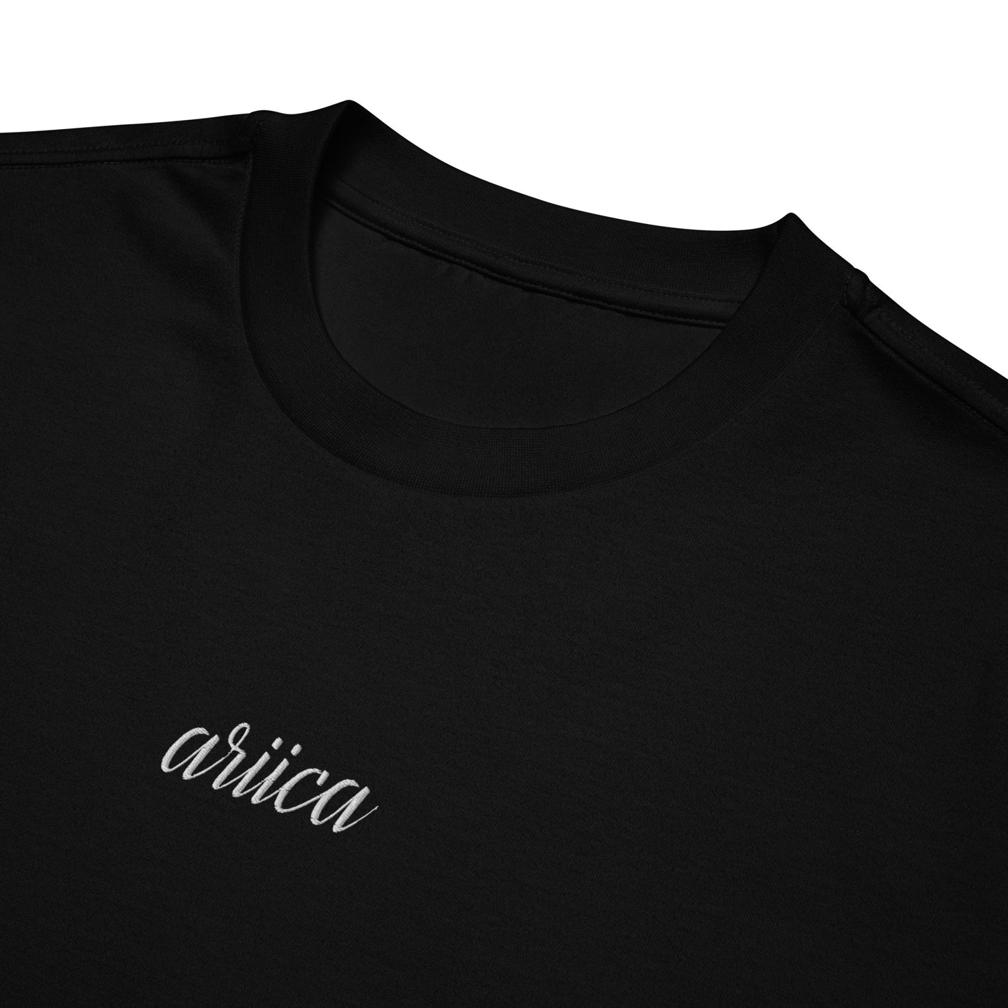 Close-up of the Oversized Black Heavyweight Tee with intricate white Embroidery, highlighting premium detail and craftsmanship