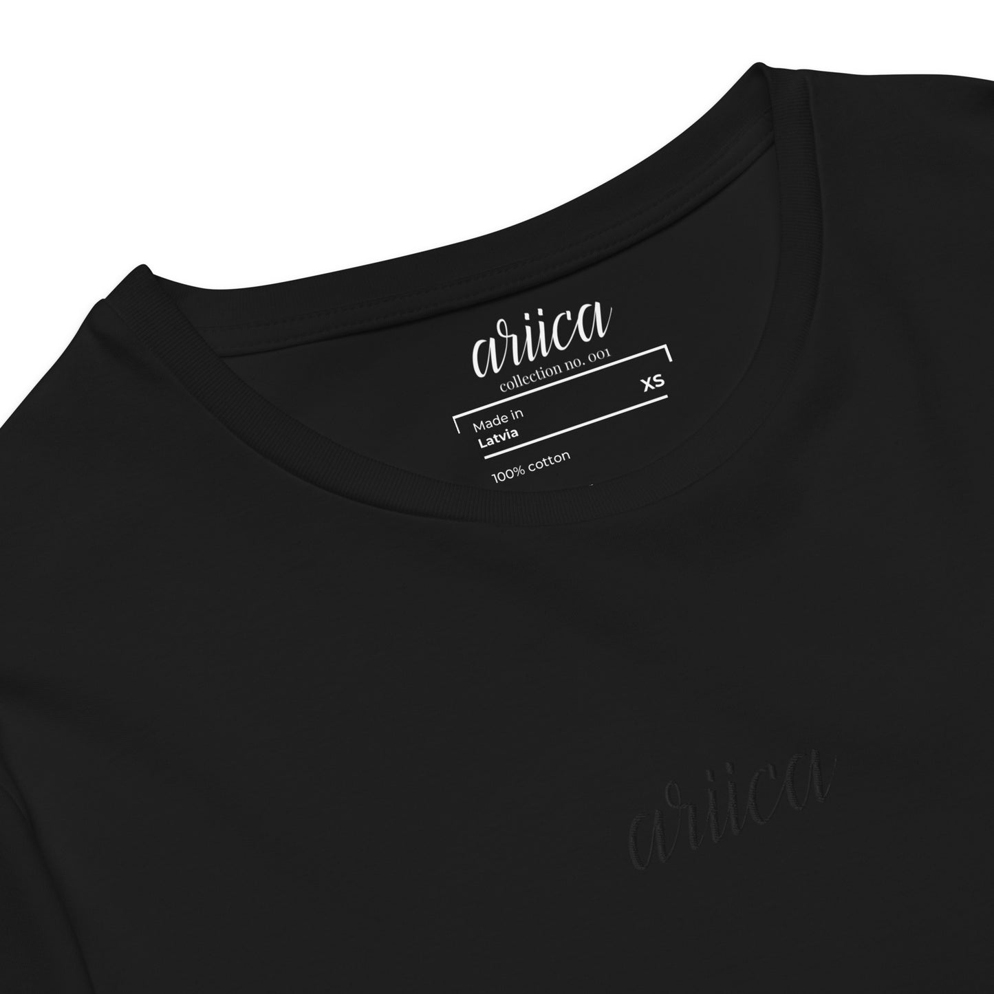 Close-up of the Premium Black Cotton Tee with detailed black Embroidery, highlighting refined craftsmanship and quality stitching