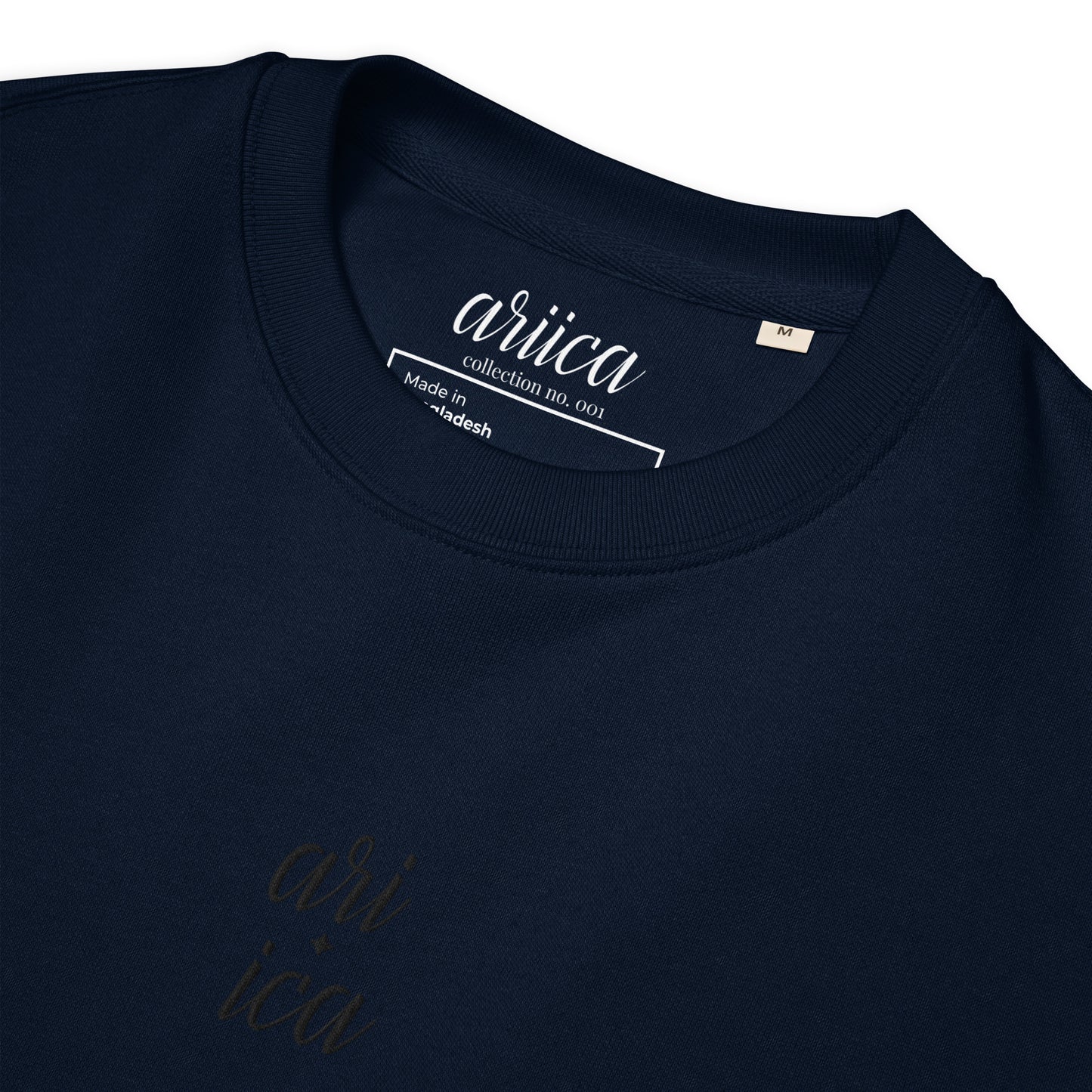 Close-up of the French navy Organic Sweatshirt with detailed black split Embroidery, highlighting the intricate stitching and luxurious fabric.