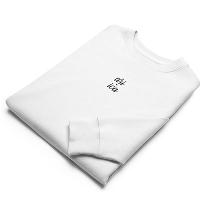 Folded White Organic Sweatshirt with black spilt Embroidery, featuring minimalist luxury and sustainable craftsmanship.