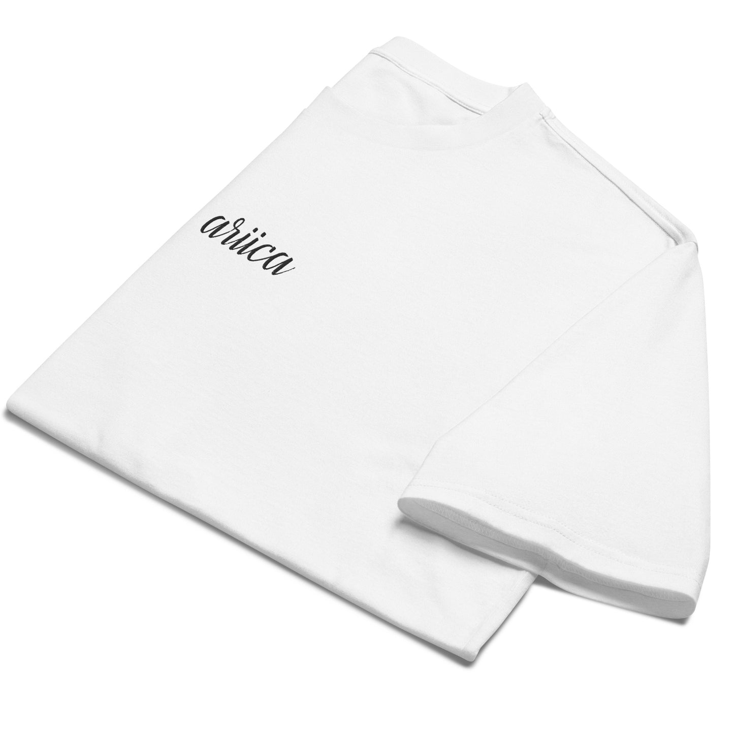 Folded Oversized White Heavyweight Tee with black Embroidery, emphasizing minimalist design and high-quality fabric