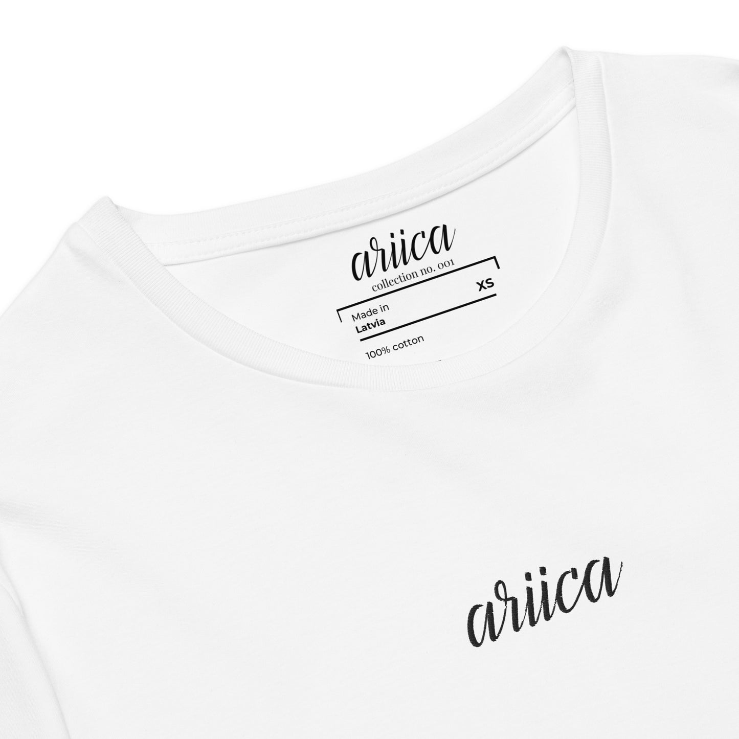 Close-up of the Premium White Cotton Tee with detailed black Embroidery, highlighting refined craftsmanship and quality stitching