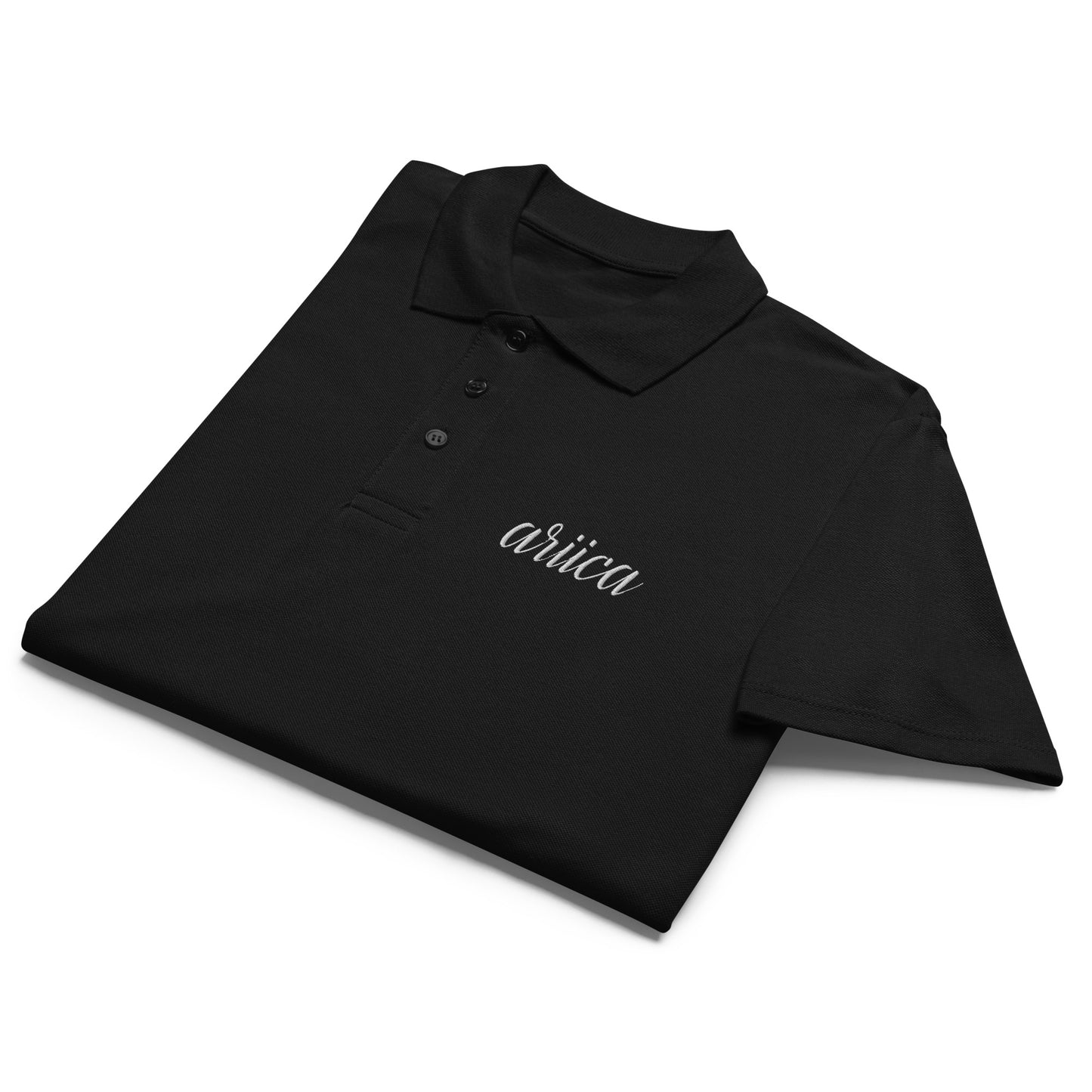 Black Premium Polo Shirt with white embroidery, neatly folded to showcase its soft fabric and refined design.