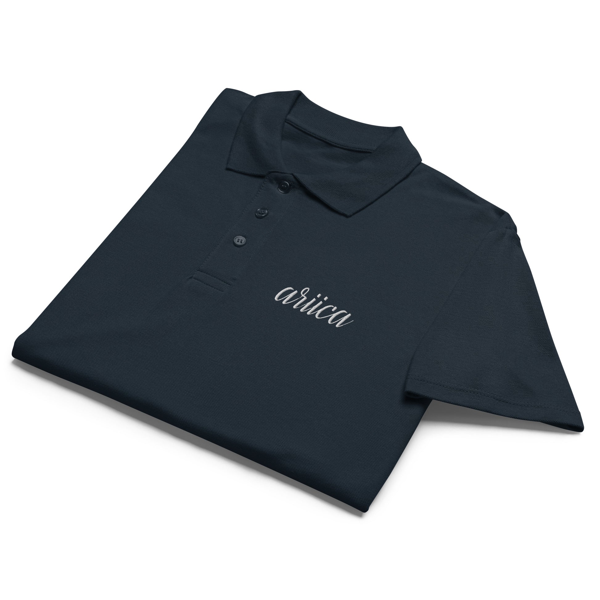 Navy Premium Polo Shirt with white embroidery, neatly folded to showcase its soft fabric and refined design.