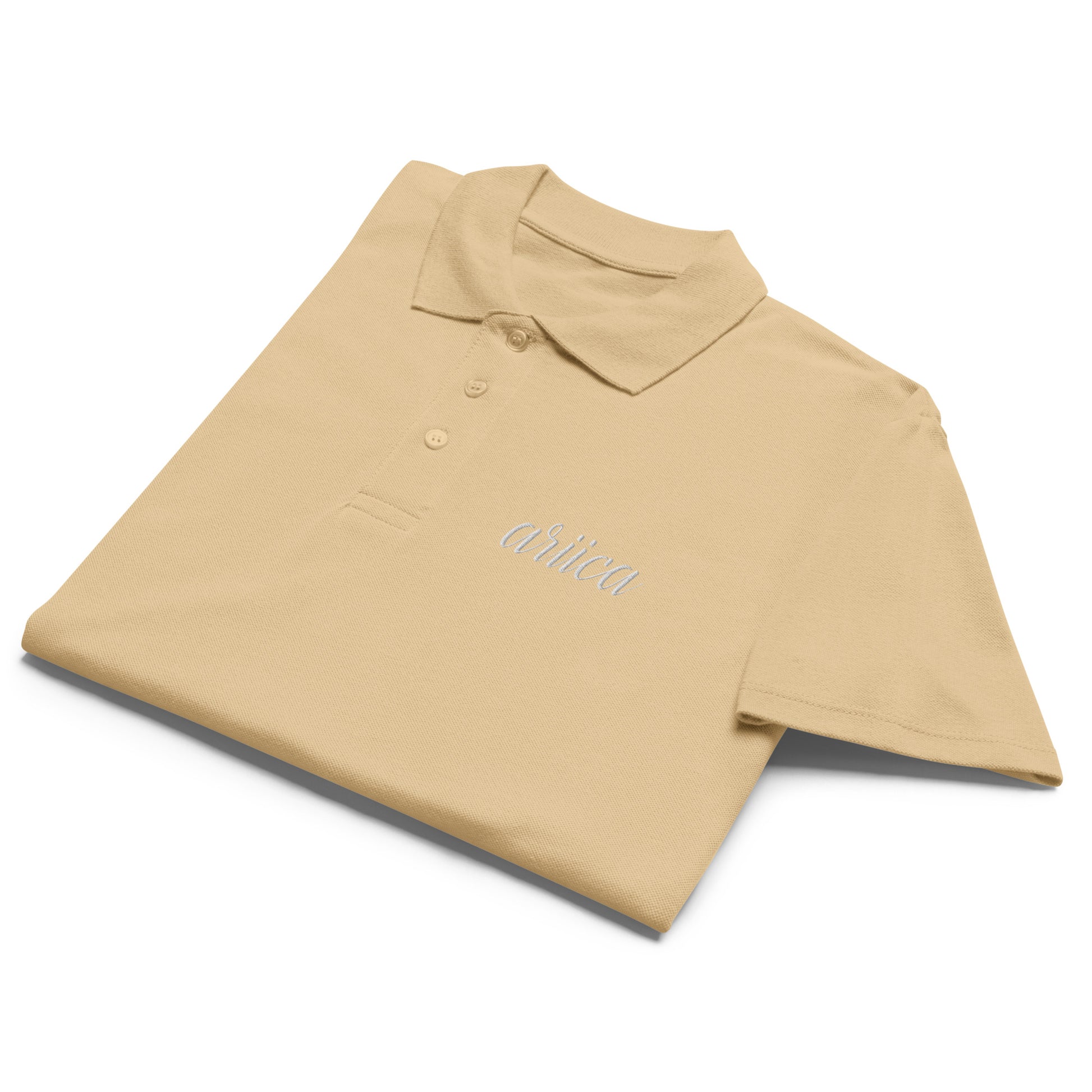 Sand Premium Polo Shirt with white embroidery, neatly folded to showcase its soft fabric and refined design.